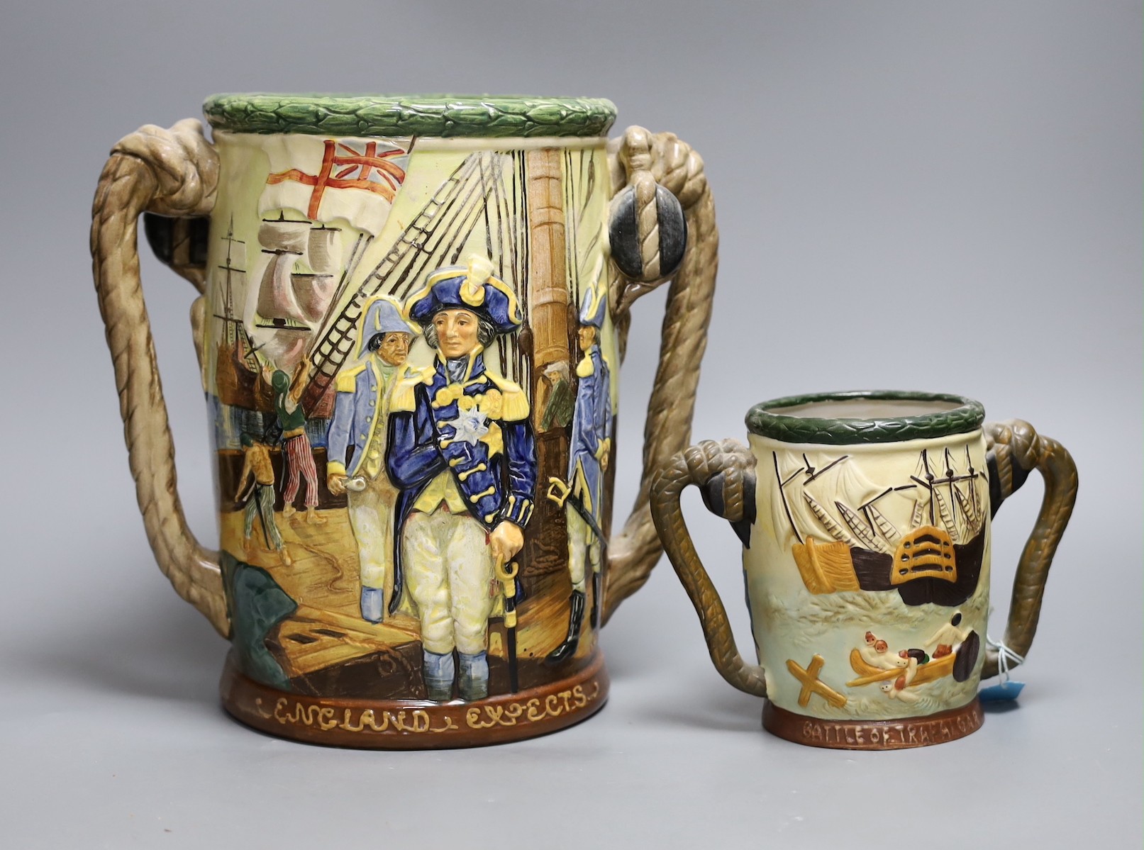 A Royal Doulton Nelson commemorative loving cup, no.453/600, 27cm tall, together with another cup